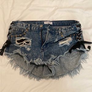 Studded side tied jean distressed style jean shorts
